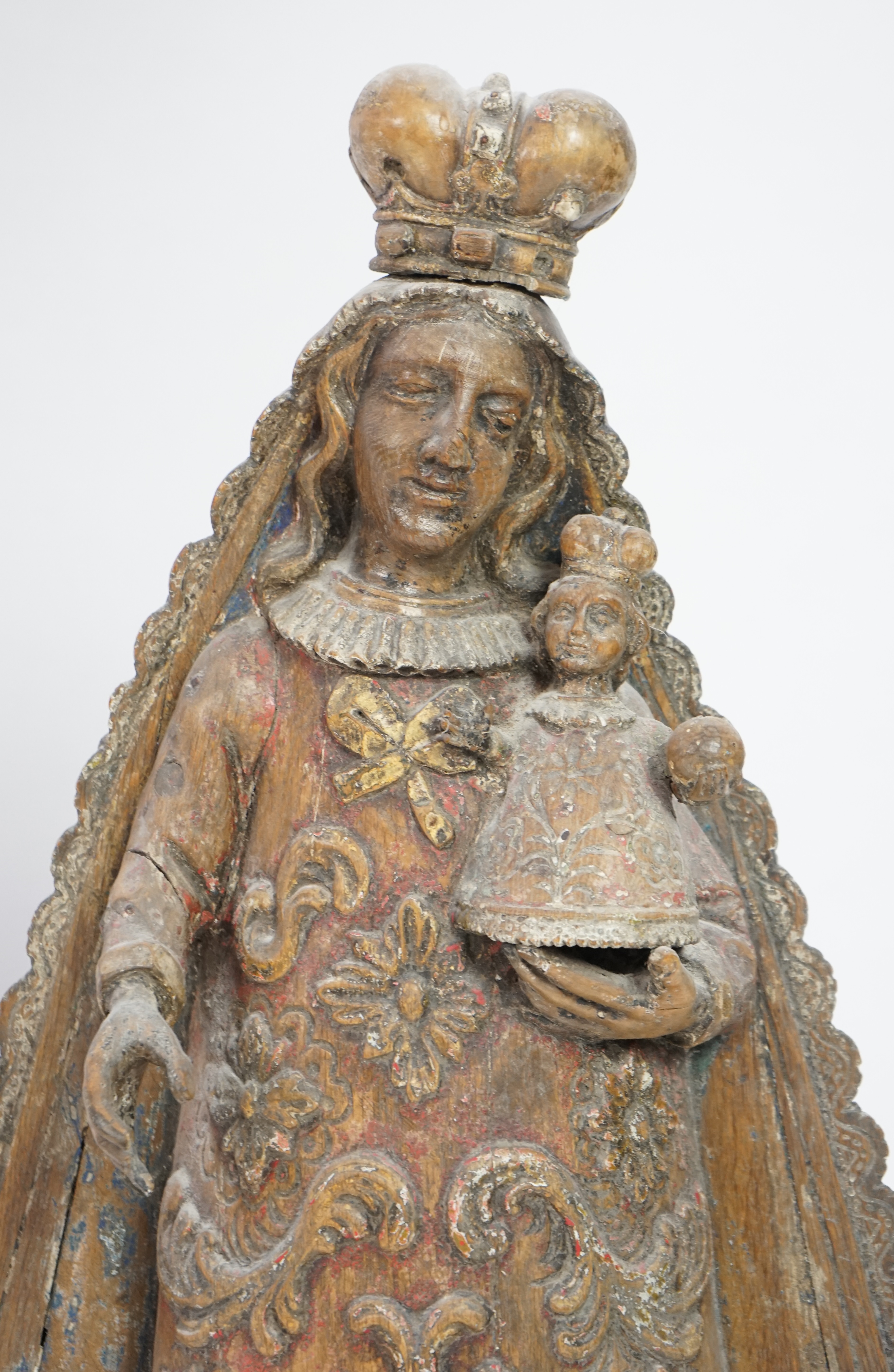 A late 18th century Spanish polychrome oak group of the Madonna and child